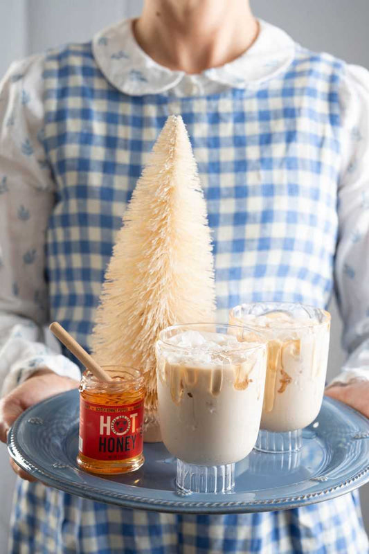 Spicy white Russian on a tray with hot honey.