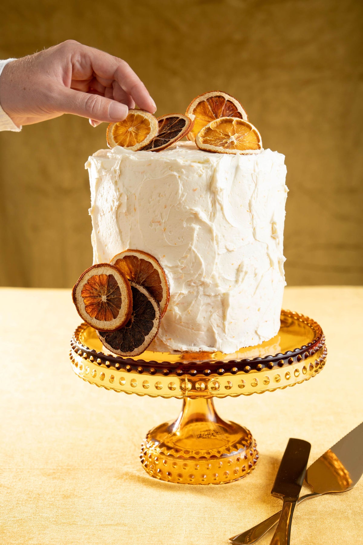 Orange Cream Cake on a cake stand.